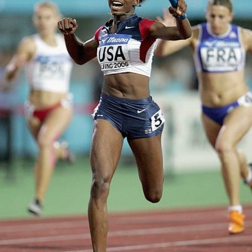 BEIJING - AUGUST 20:  Gabby Mayo of the United States celebrates winning the Women's 4x100 Meters Relay on the 6th day of the 11th IAAF World Junior Championships on August 20, 2006 in Beijing, China.  (Photo by Andy Lyons/Getty Images)